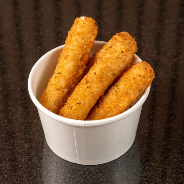 Golden-brown mozzarella sticks, seasoned with herbs, served upright in a white paper cup on a dark surface.